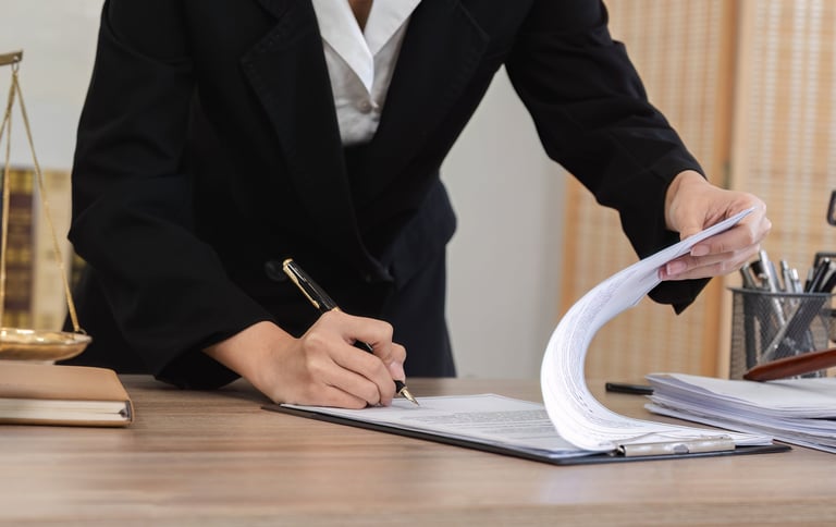 Young lawyer signing contract with clients